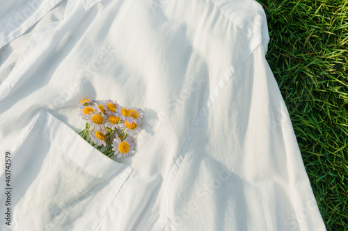 Close-up of flowers in white shirt pocket. photo
