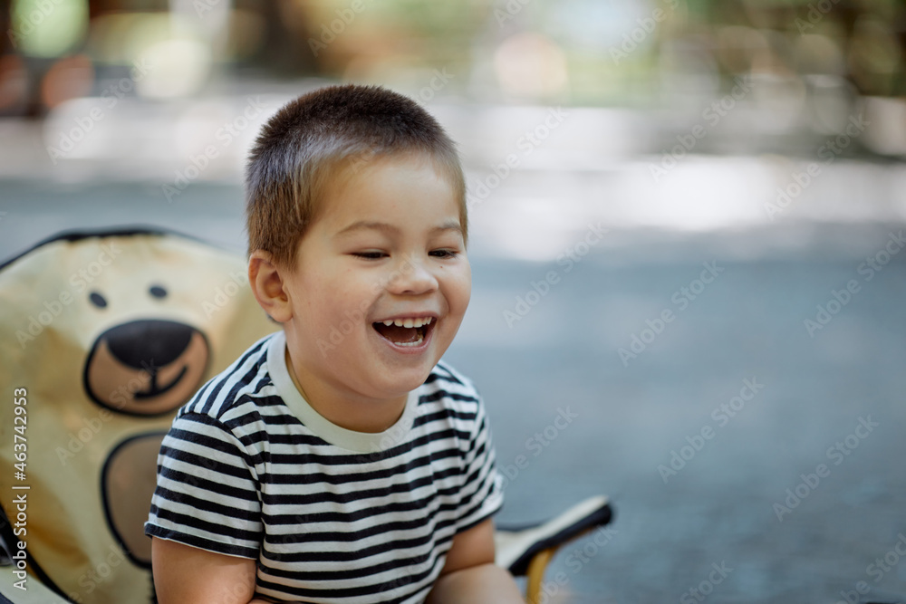 Cute Mixed Asian Boy Laughing Outside At A Barbecue Stock Photo Adobe