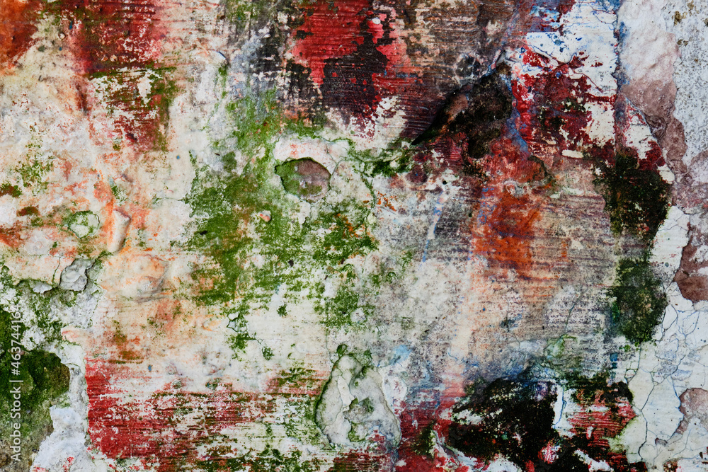 Crumbling Concrete Wall with Orange and Green Paint Crumbling Concrete Wall with Orange and Green Paint