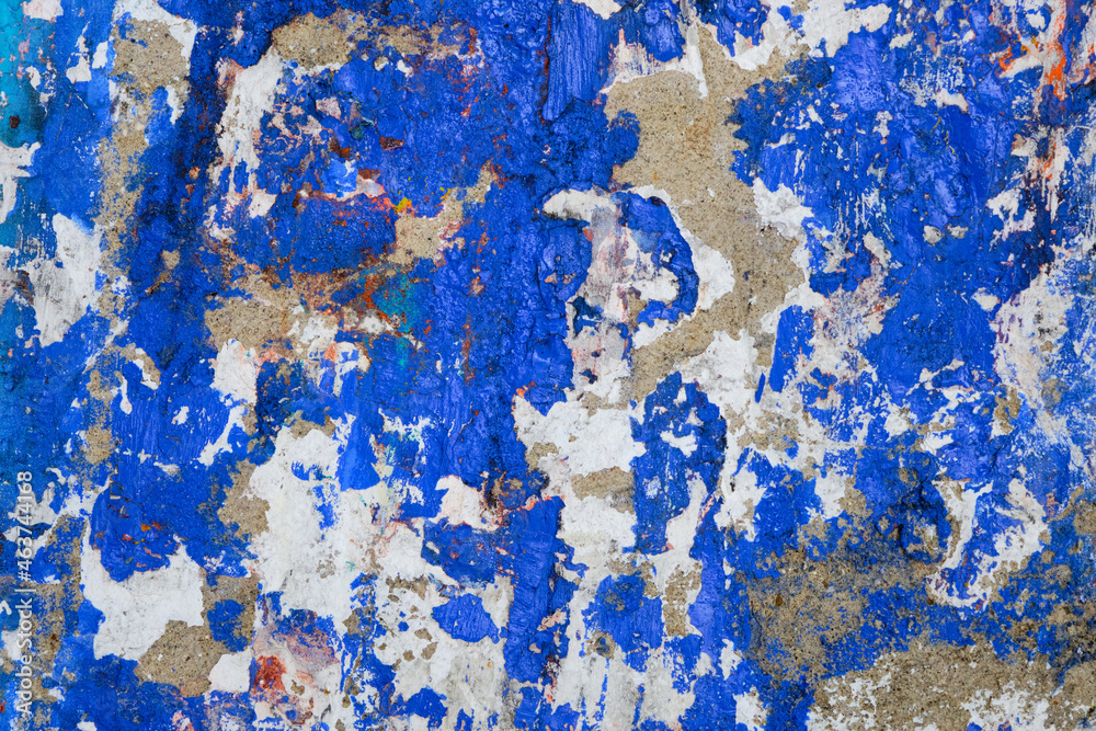 Battered  Concrete Wall with Blue and White Paint 