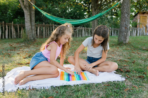 Young girls having fun with a hula hoops