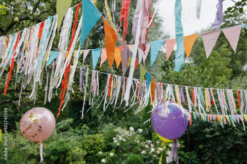 Fabric flags and ribbons in the garden photo