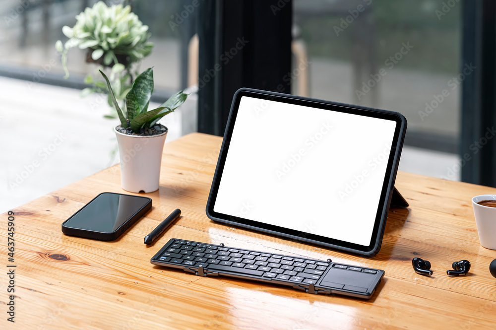 Mock up portable tablet with keyboard and gadget on wooden table. Mock up portable tablet with keyboard and gadget on wooden table.
