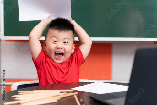 little boy writing