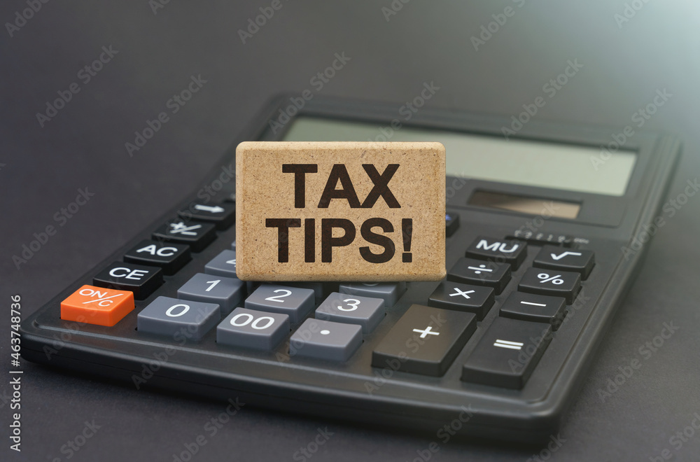 There is a sign on the calculator that says - Tax Tips There is a sign on the calculator that says - Tax Tips