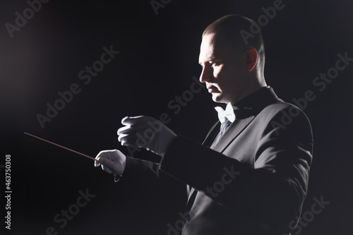 Orchestra conductor music conducting symphony. Maestro