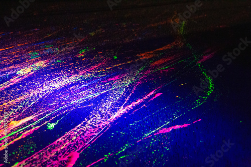 A skateboarders marks of fluorescent paint on street 