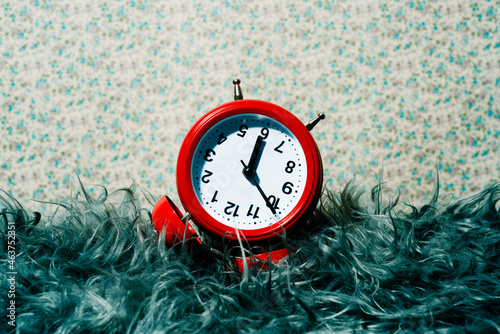 red alarm clock upside down