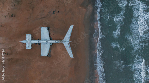 overhead view of a military plane on the seacoast photo