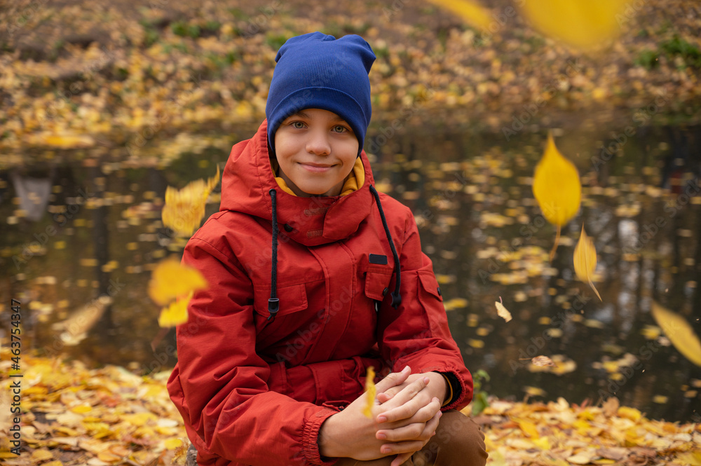 Autumn portrait of boy teen on fall nature background Autumn portrait of boy teen on fall nature background