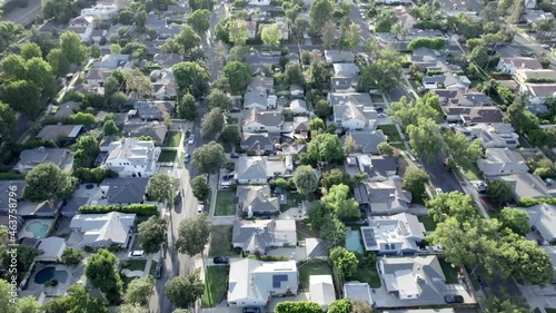 Modern single family homes in Van Nuys, California, aerial forward photo