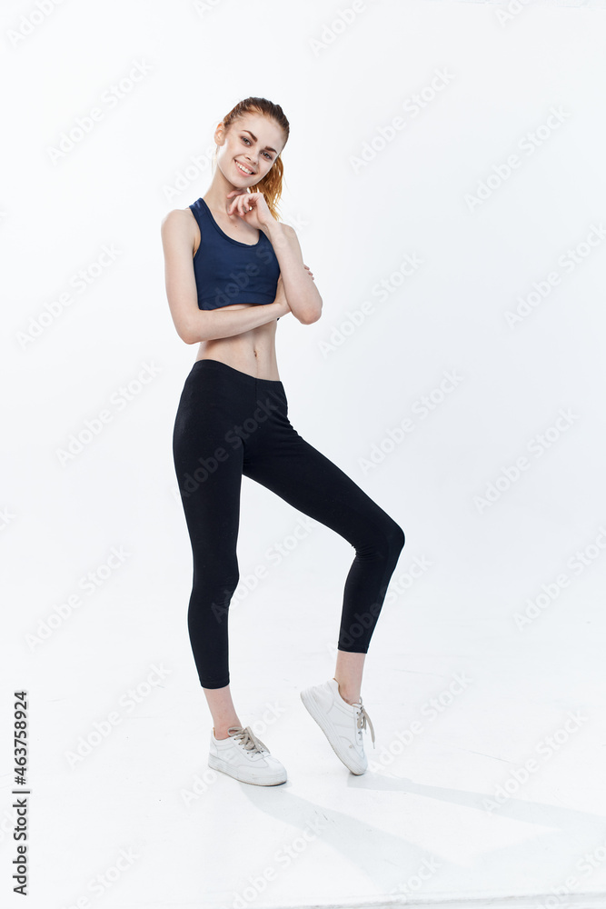 cheerful sportive woman with her leg raised workout lifestyle jumping