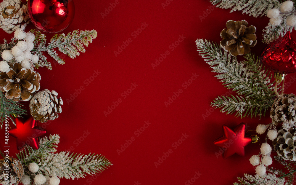 red background,Christmas tree branches, cones. festive. new year red background,Christmas tree branches, cones. festive. new year