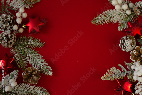 red background Christmas tree branches  cones. festive. new year
