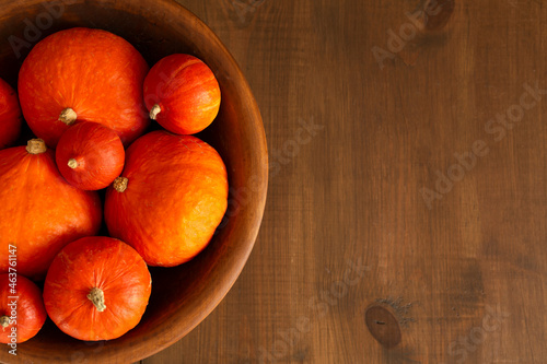 Pumpkins on a wooden background Flat lay