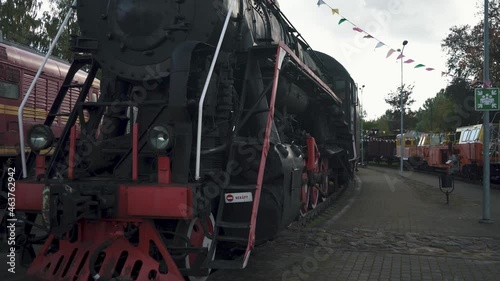 Railway Old Cargo Platform at Station in Latvia. Vintage Soviet Locomotive With Steam Engine Old Train at Latvian Railway Museum. Stedicam Shot. photo