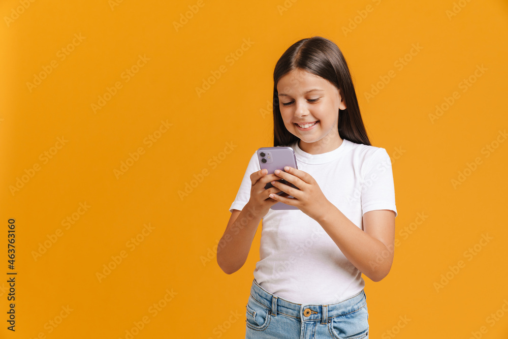 White brunette girl smiling while using mobile phone White brunette girl smiling while using mobile phone