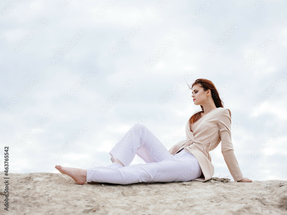 beautiful woman sitting on the sand model Travel beautiful woman sitting on the sand model Travel