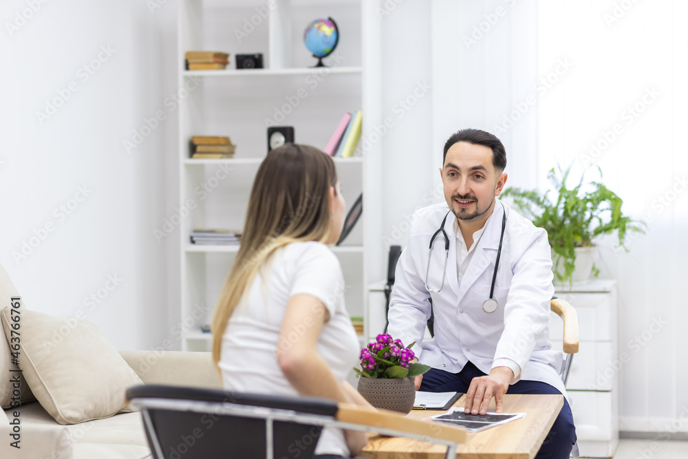 Photo of pregnant woman visiting her doctor. Photo of pregnant woman visiting her doctor.