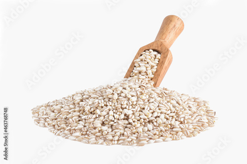 Heap of pearl barley isolated on white photo