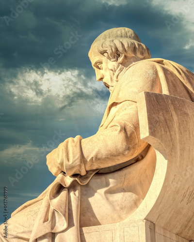 Plato the ancient Greek philosopher statue under dramatic sky, Athens Greece photo