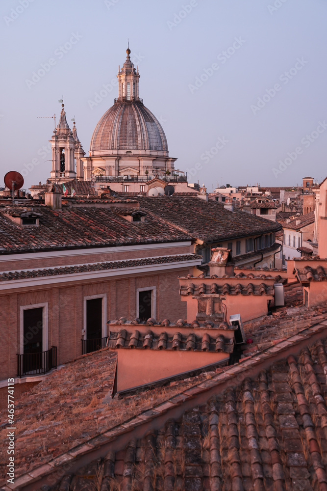 Aerial panoramic view of red roofs of Rome, sights of the old city of Roma photographed at the sunrise