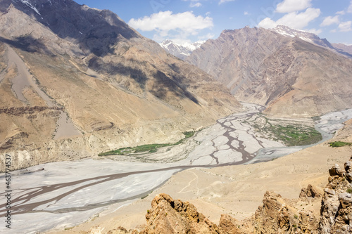 Aerial view of the Himalayan landscape around the wide bed of the Spiti river from the village of Dhankar in Himachal Pradesh, India.