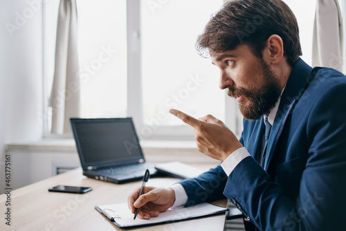 Man working for a laptop in the office emotions internet official
