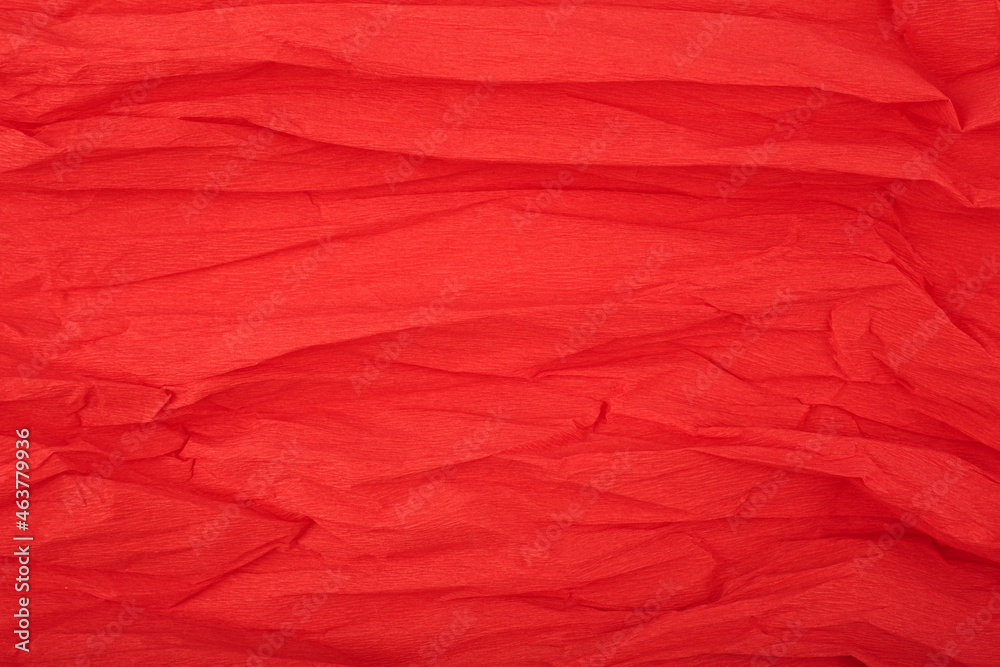 Red crumpled corrugated wrapping paper textured background with space for text