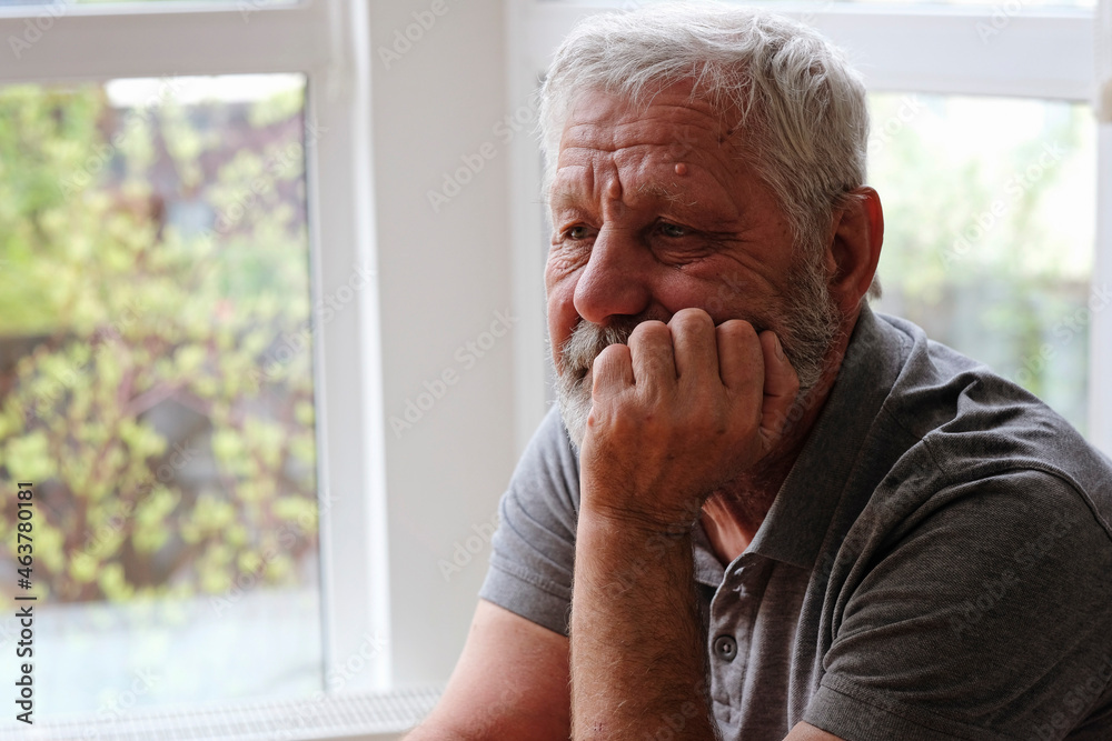 Senior retired man sitting at home alone while quarantine Senior retired man sitting at home alone while quarantine