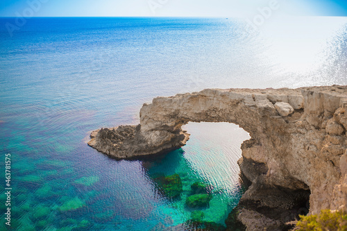 Beautiful picturesque cliffs of Ayia Napa in Cyprus. Arch Bridge of lovers. On the Mediterranean coast, background with a beautiful rock texture as a concept for travel and tourist excursions. © Vera