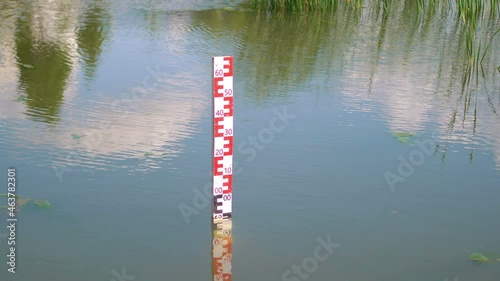 Water level alert dipstick in water in 4k slow motion 60fps