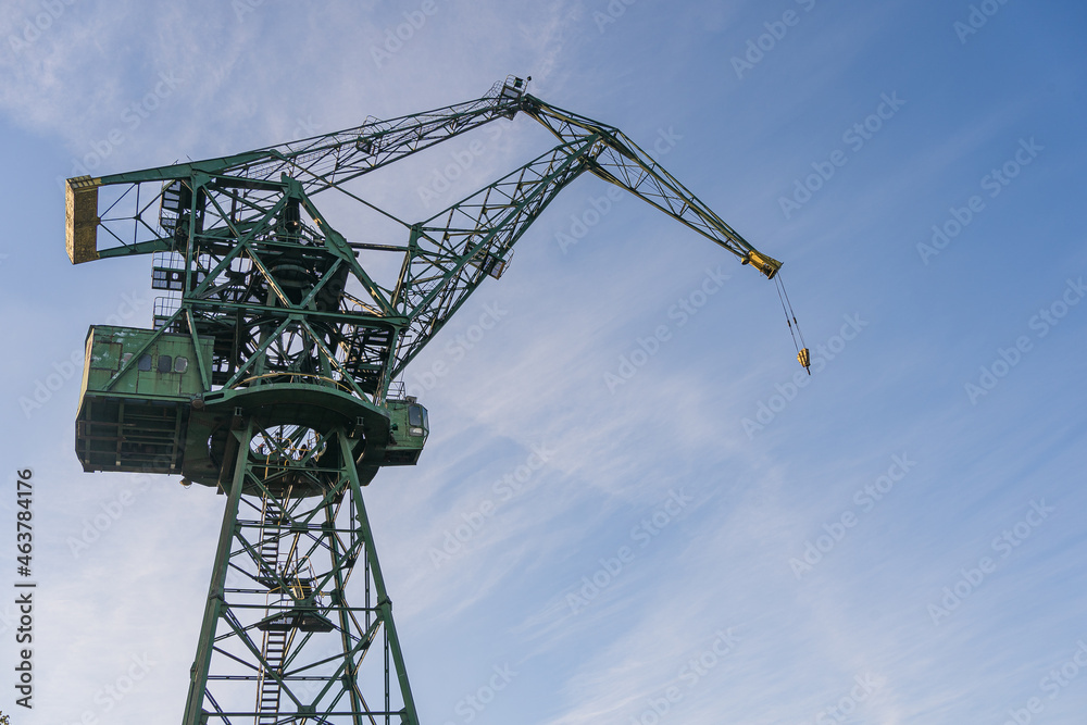 Gdansk, Poland. 2021 Old shipbuilding company. Cranes for the construction of boats. On the Sunset. Gdansk, Poland. 2021 Old shipbuilding company. Cranes for the construction of boats. On the Sunset.