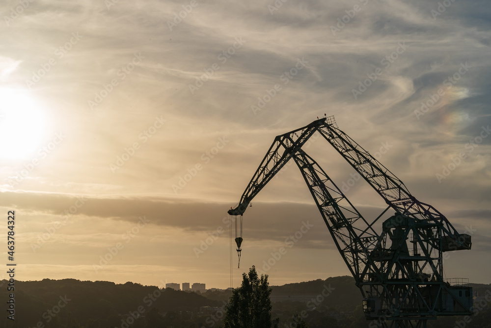 Gdansk, Poland. 2021 Old shipbuilding company. Cranes for the construction of boats. On the Sunset. Gdansk, Poland. 2021 Old shipbuilding company. Cranes for the construction of boats. On the Sunset.