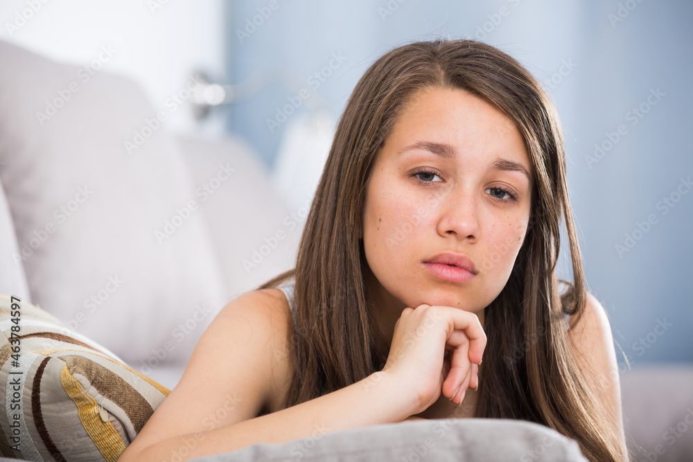 Obraz premium Young female is feeling sad and lonely at home.