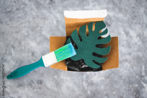 фотографія greenwashing and companies pretending to be sustainable, paper leaf with green b