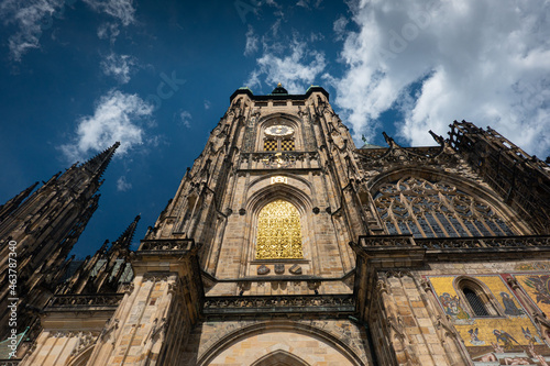 Prague Castle and Saint Vitus Cathedral, amazing architectural details and a great construction photographer during a sunny summer day. Landmarks of Europe. Travel photography.
