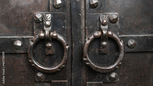 antique door. iron handles on the old door