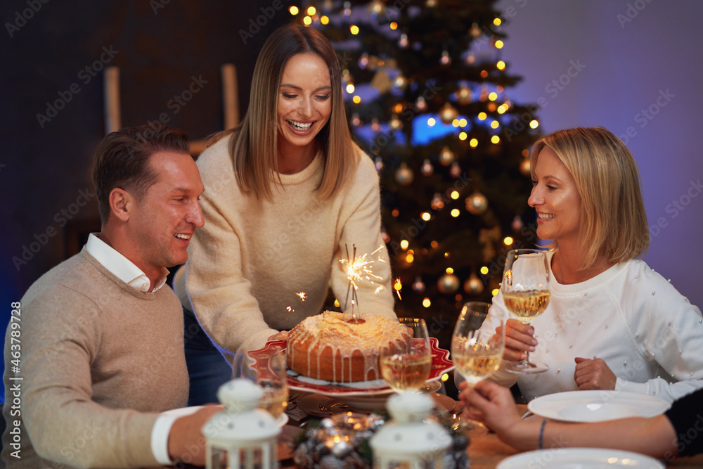 Friends celebrating christmas party holding wine Friends celebrating christmas party holding wine