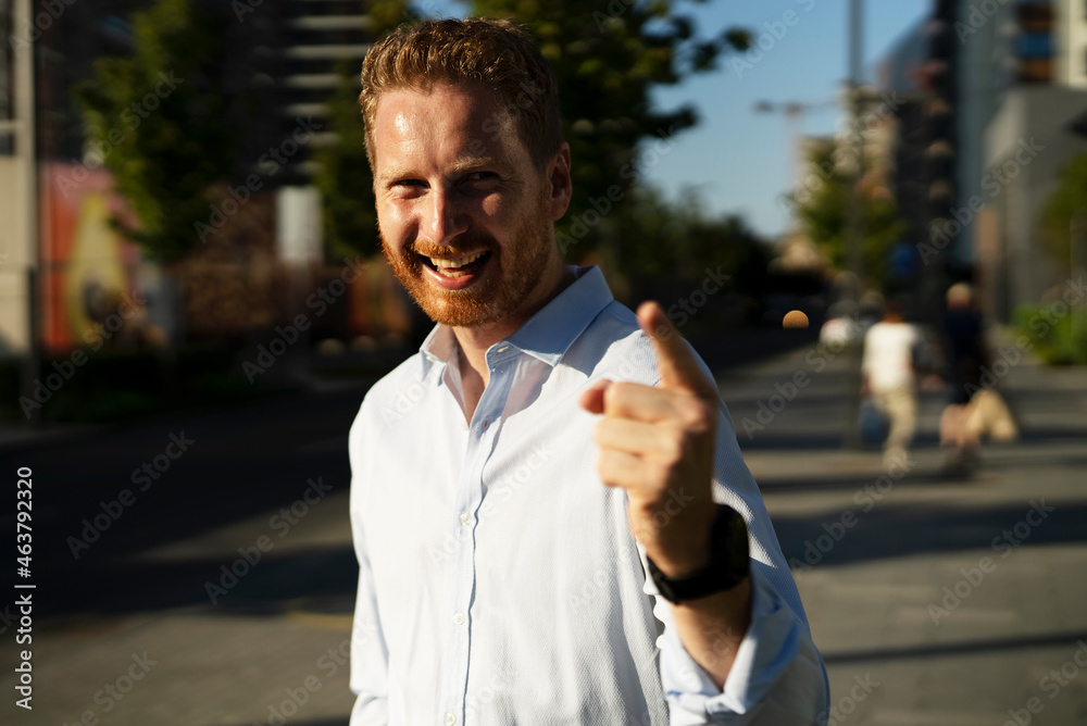 Young stylish businessman. Portrait of handsome man outdoors.
