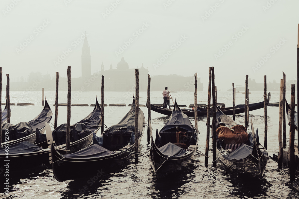 Romantic view of gondolas and grand canal of Venice.
