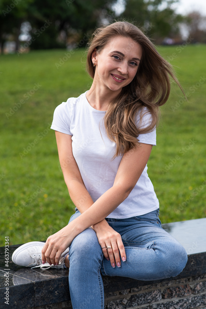 Obraz premium Portrait of a young, happy and attractive blonde Caucasian girl.