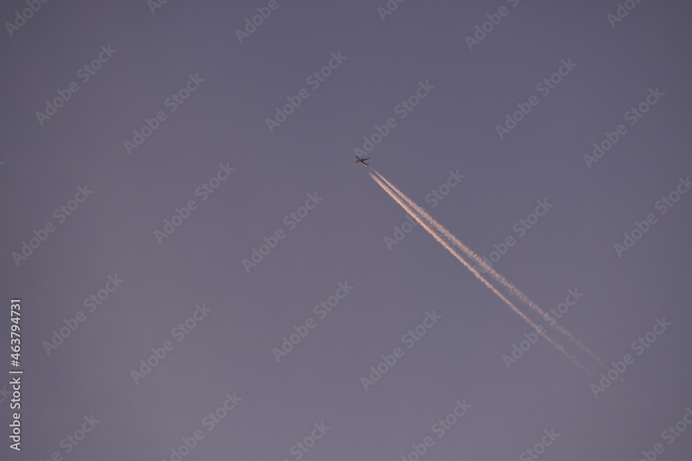 jet plane for passengers on the blue sky. domestic transport aircraft polluting with smoke in the blue sky
