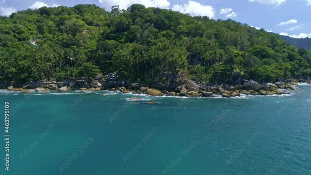 Aerial view of Phuket island waves break on rocks Stones in blue ocean Sea waves crashing on beautiful seashore aerial view drone 4k shot Amazing nature seascape High quality footage from drone camera Aerial view of Phuket island waves break on rocks Stones in blue ocean Sea waves crashing on beautiful seashore aerial view drone 4k shot Amazing nature seascape High quality footage from drone camera
