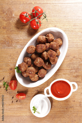 fried meatballs with tomato sauce