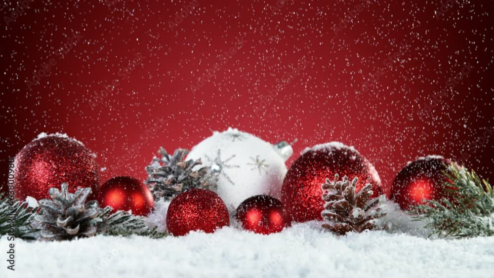 Super slow motion of falling snow with christmas glass balls. Filmed on high speed cinema camera, 1000 fps.