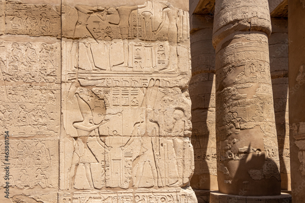 Ancient Egyptian murals and writings on the stone walls of the Karnak Temple in Luxor