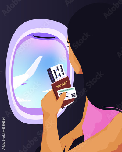Woman looking out airplane window