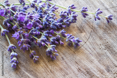 Lavender flowers on old wooden background 