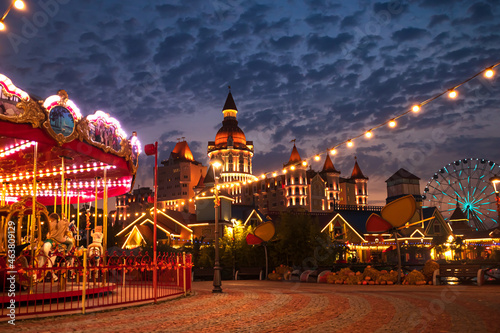 Carousel in the night autumn park.
